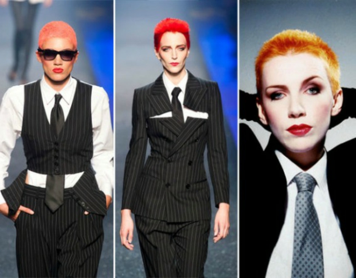 three images of women wearing variations of pin stripe suits and black ties, very short red and orange hair, hands in pockets and behind head
