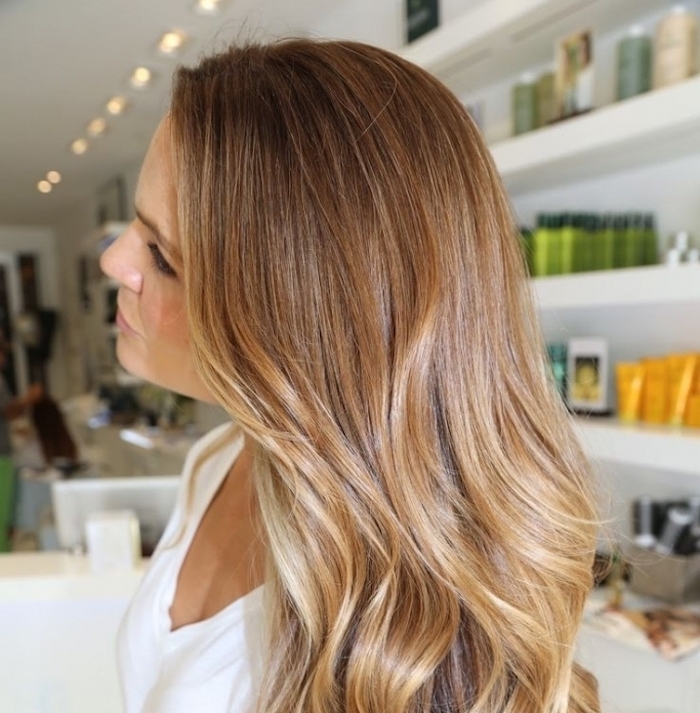 balayage brown hair, woman with light brunette, soft and wavy tresses, with honey blonde balayage, wearing white t-shirt