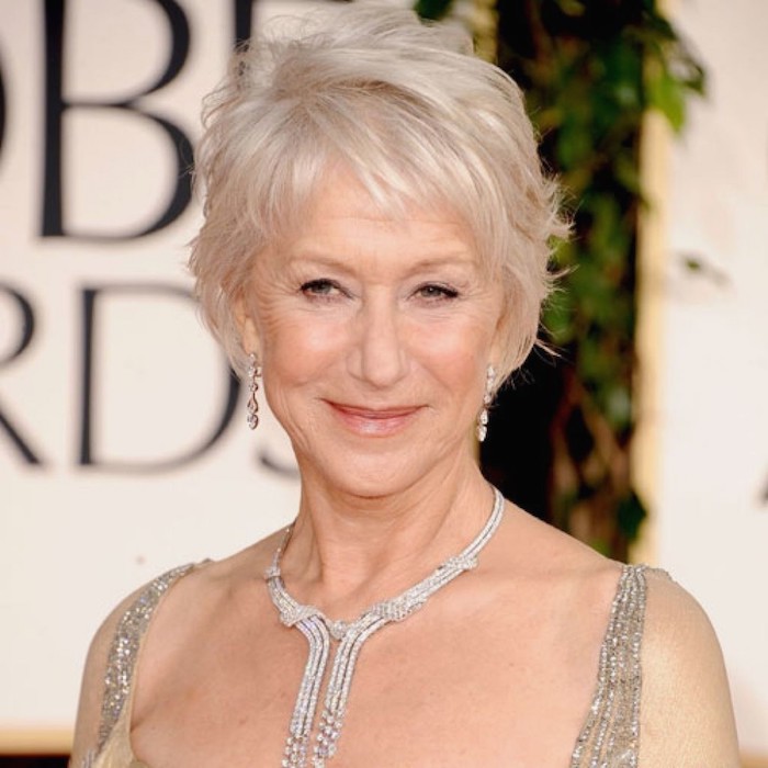silver wavy pixie cut, with messy bangs, worn by helen mirren, with a encrusted silver necklace, and a strappy embroidered top, hairstyles for women with thin hair