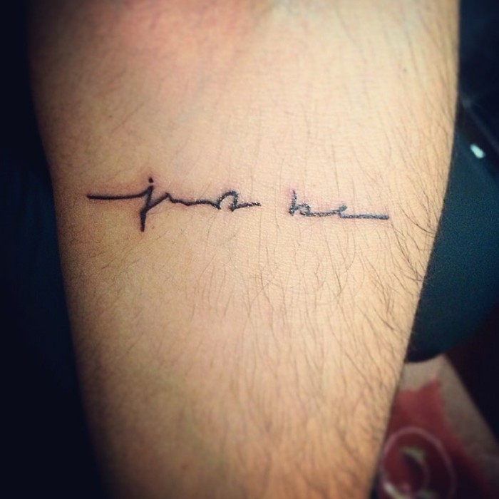 the words just be, written in black handwriting, tattooed on the back of a man's lower leg, inspirational and motivating