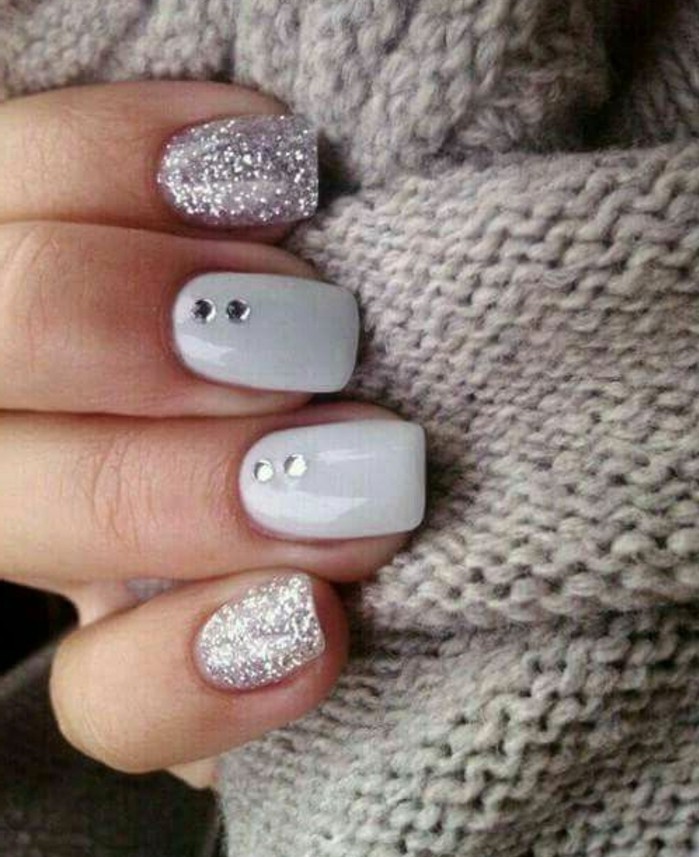 Nail Ideas With Jewels nail designs with rhinestones and glitter close up of four fingers on grey woolen fabric 100 ideas for nails with rhinestones trendy in 2017