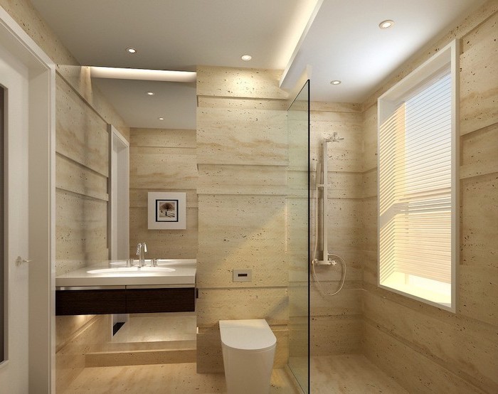beige sand tiled walls and floor, bathroom remodel ideas, large mirror, floating wooden shelf and sink