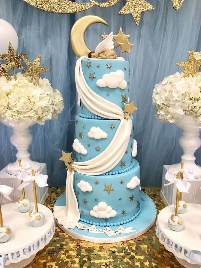 three tier blue cake, baby shower decoration ideas, little angel cake topper, white flower bouquets