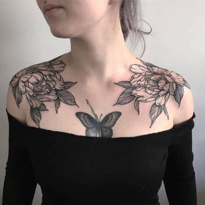butterfly in the middle, large flowers on both shoulders, black top, white background, rose chest tattoo