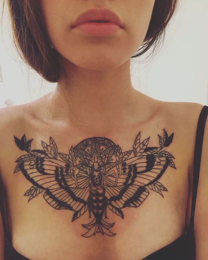 black top, white background, tattoos for women with meaning, large symmetrical moth tattoo