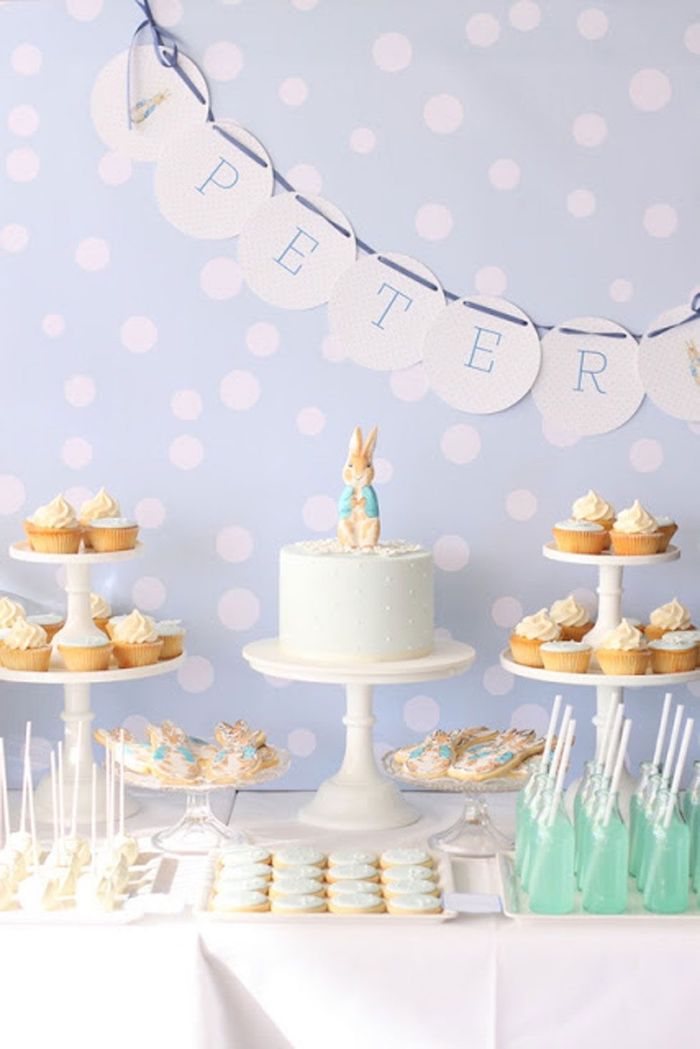 blue dotted backdrop, baby shower theme ideas, cake and sweets on the table, peter rabbit cake topper