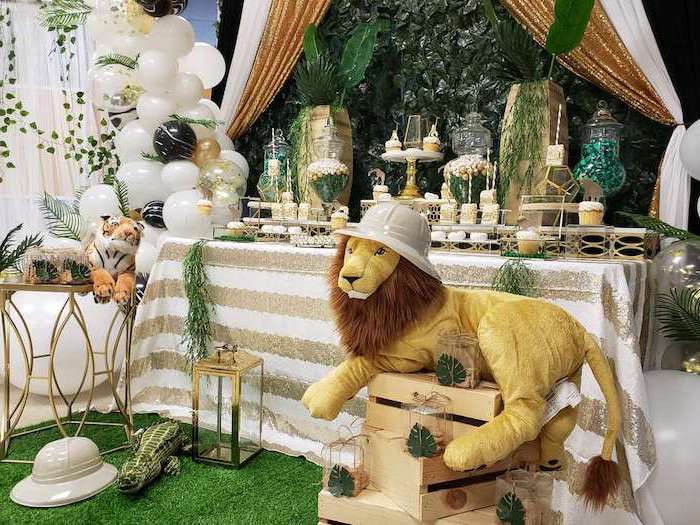 big plush lion, white balloons, sweets on the table, unique boy baby shower themes, wooden crates