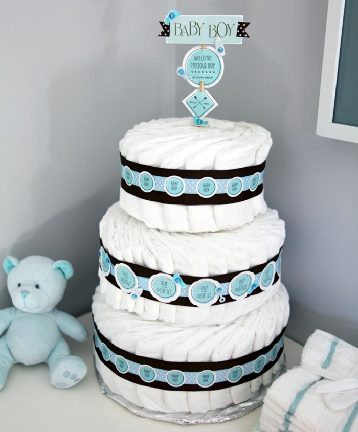 three tier diaper cake, baby boy cake topper, baby shower decoration ideas, black and blue ribbons