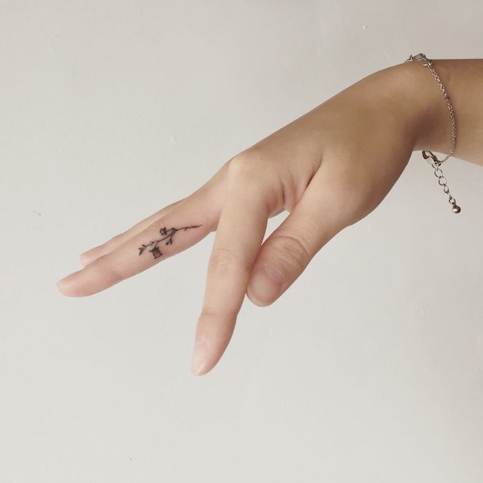 flower tattoo finger