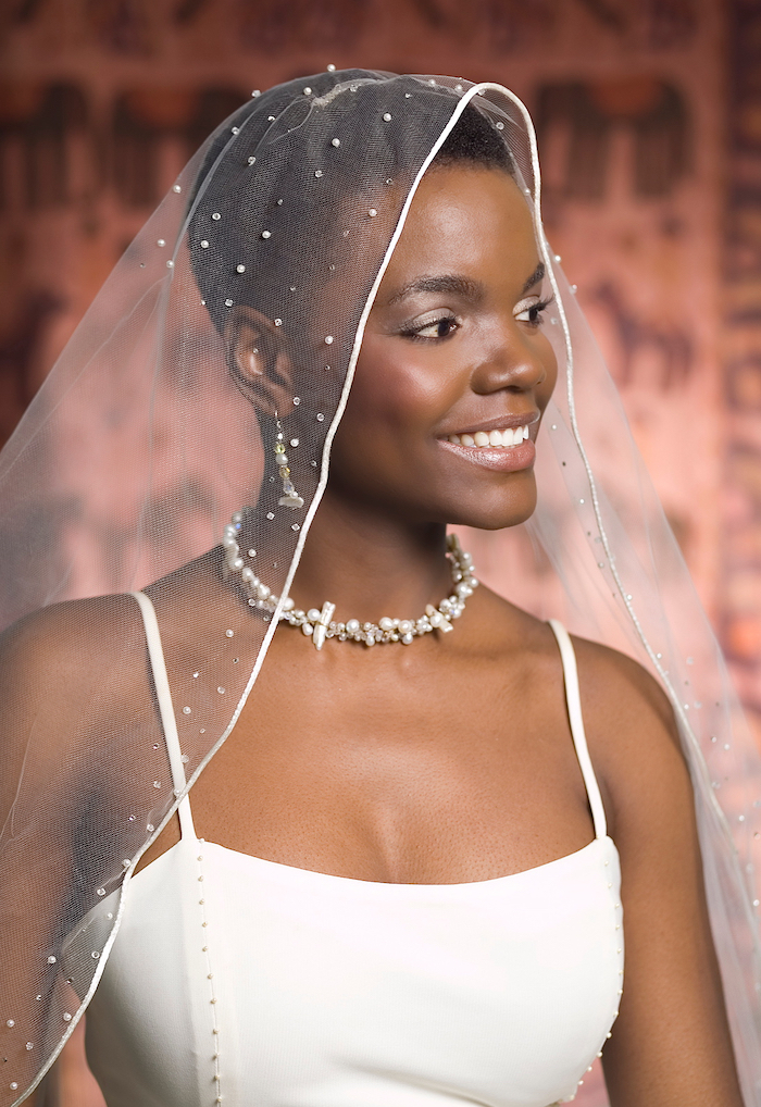 pixie cut, short black hair, white veil, wedding hairstyles down, white dress, pearl necklace and earrings