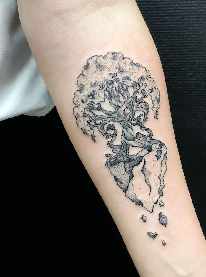 tree forearm tattoo, meaningful tattoos, white shirt, black trousers, black background