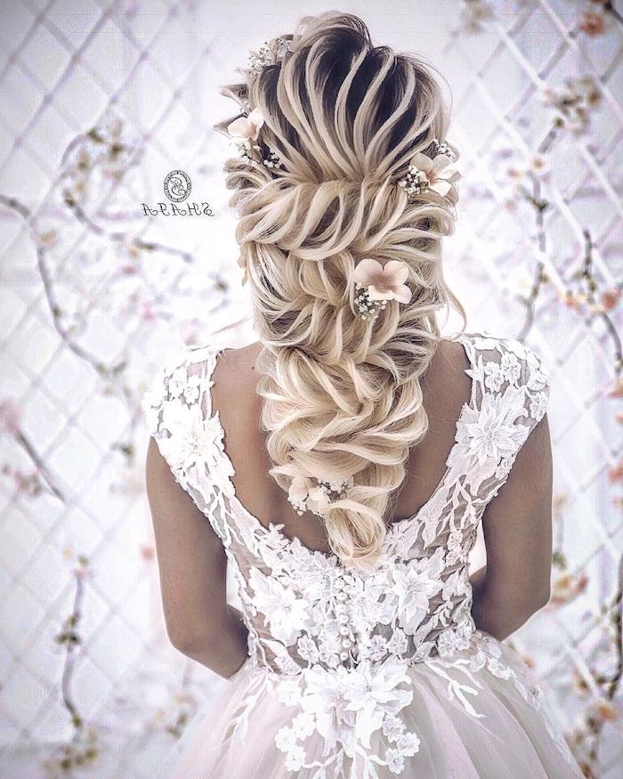 white lace dress, loose updos, braided ponytail, long blonde hair, flowers in the hair