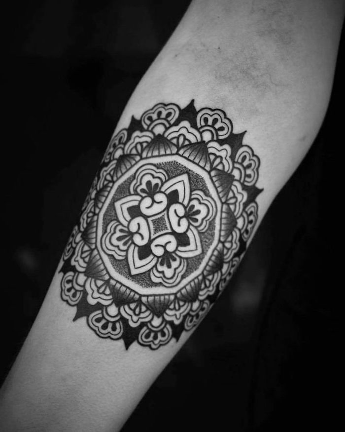 lotus mandala tattoo, black background, forearm tattoo