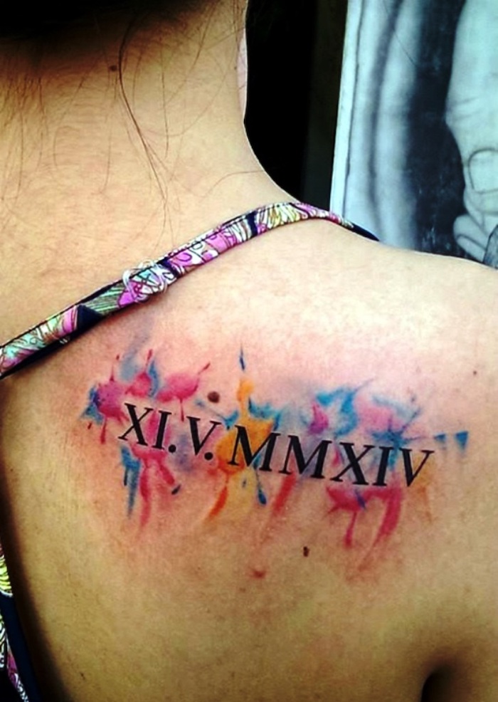 colourful straps, watercolour shoulder tattoo, roman numeral tattoos on arm