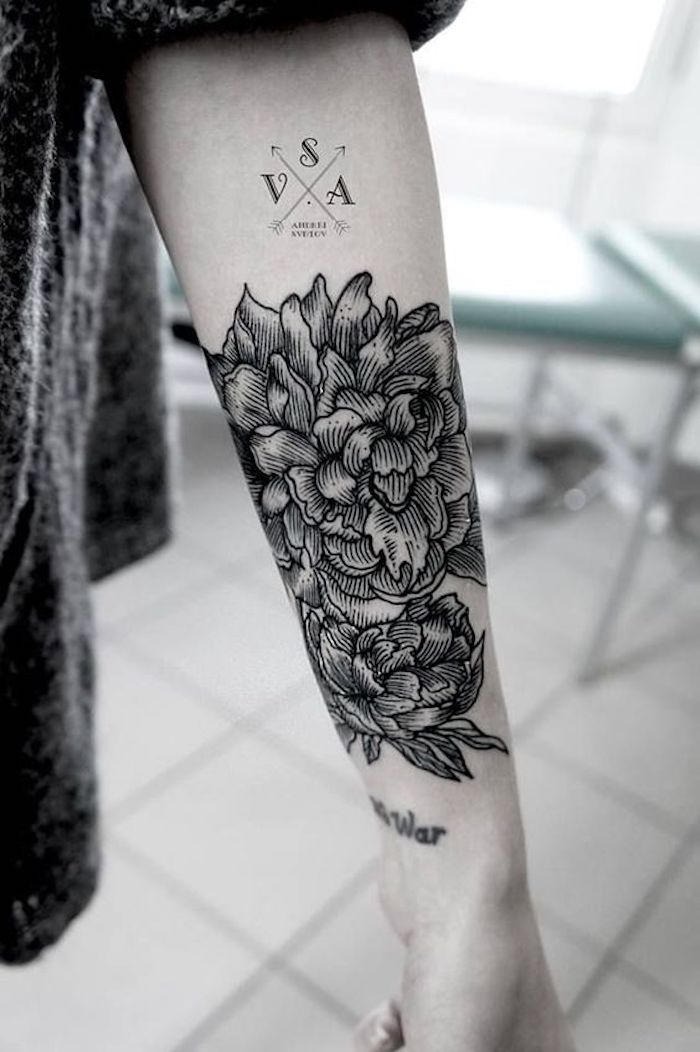 large flower, forearm tattoo, side tattoos for girls, black and white photo, tiled floor