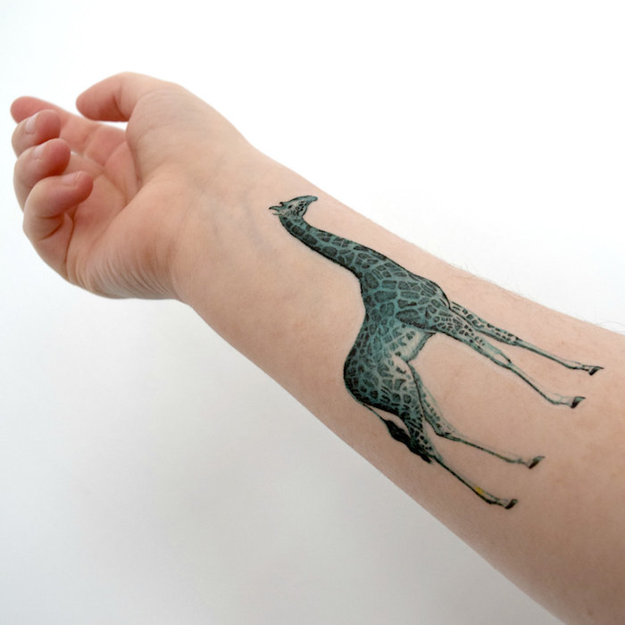 blue giraffe, forearm tattoo, tattoos for moms, white background