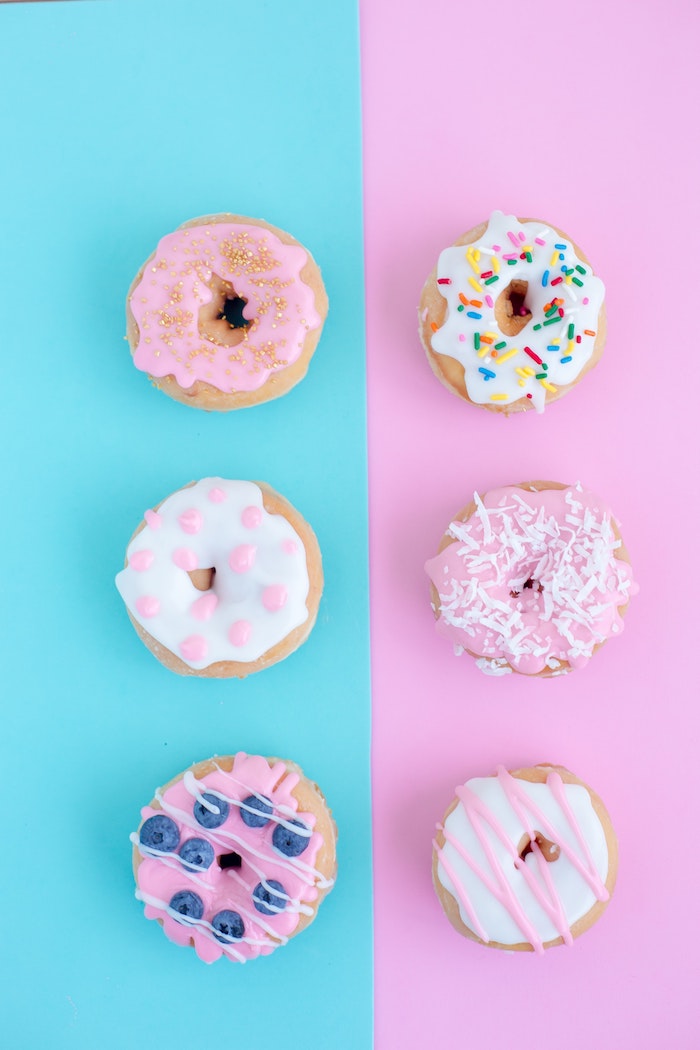blue and pink background, black on white tumblr, six donuts, with different icing