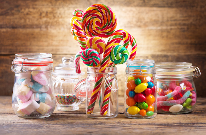 candy canes, gum balls, colourful sprinkles, in mason jars, birthday party themes, wooden background