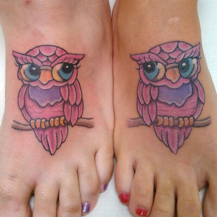 matching friend tattoos, pink owls, on tree branches, leg tattoos, red and purple nail polish