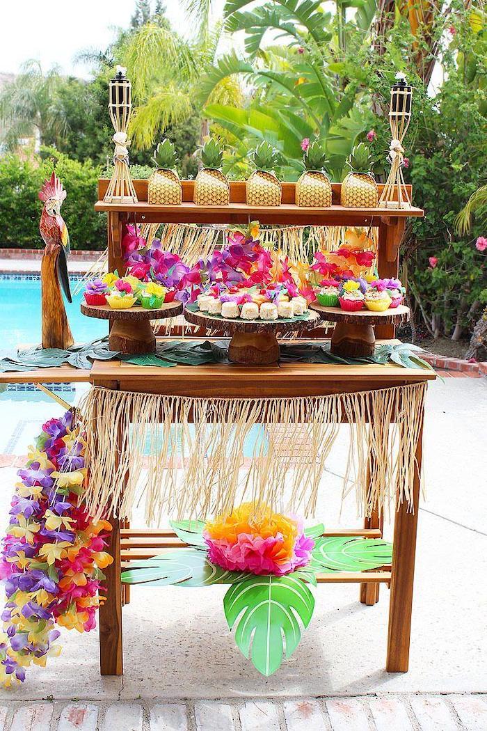 hawaiian theme, fun birthday ideas, wooden cake stands, paper pineapples, palm trees
