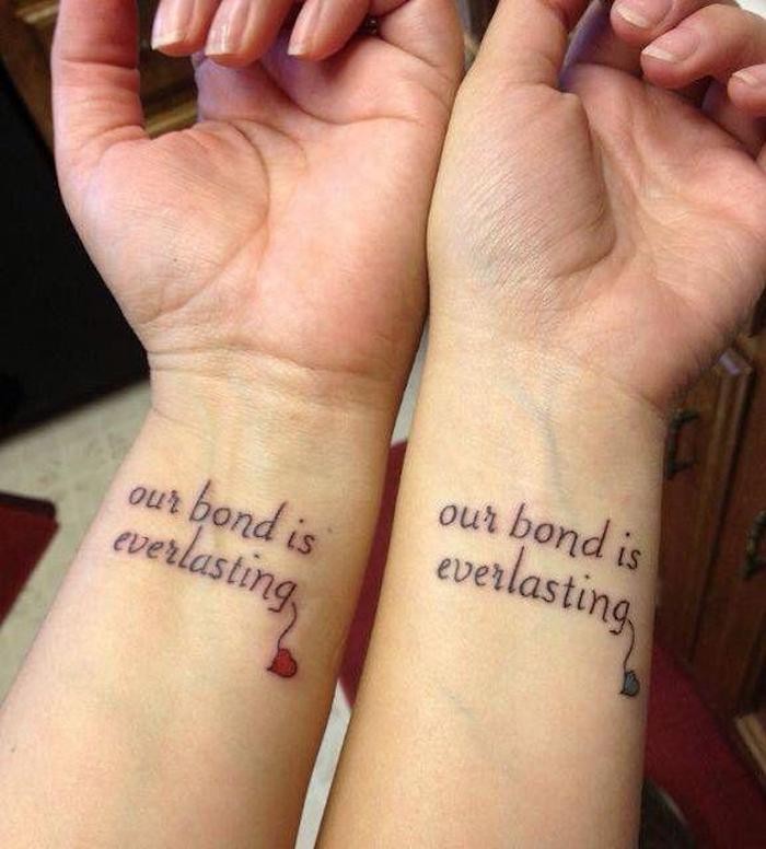 our bond is everlasting, best friend symbol tattoos, small red and blue hearts, wrist tattoos