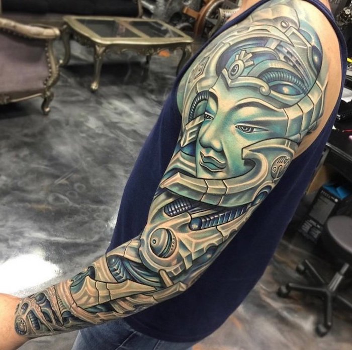 coloured biomechanical tattoo, grey floor, blue top, half sleeve tattoo