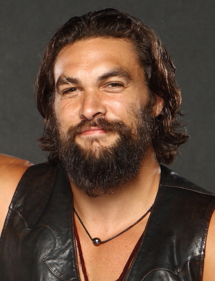 jason momoa, black leather vest, brown curly hair and beard, hair styles for men