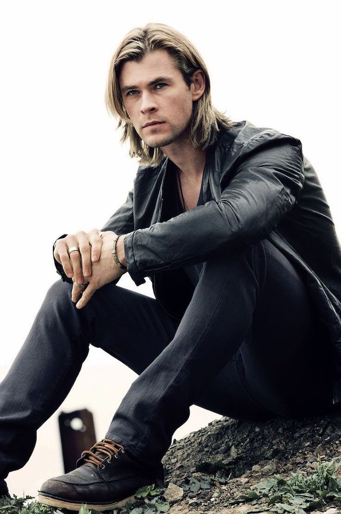chris hemsworth, sitting on the ground, medium haircuts for men, black leather jacket, blonde hair