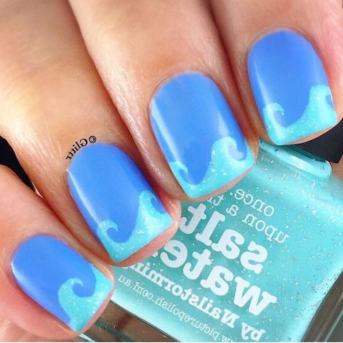 dark blue nail polish, light blue waves, manicure ideas, nail polish bottle