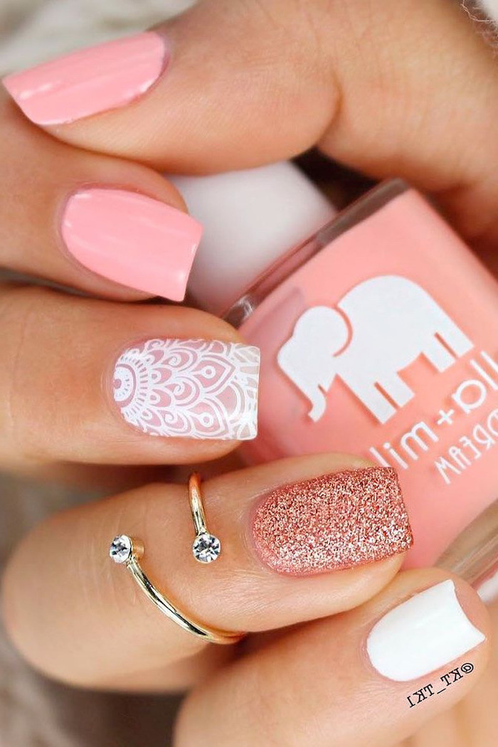 pink white and glitter nail polish, gold ring, nail design ideas, nail polish bottle