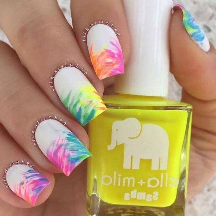 white nail polish, rainbow colored brush strokes, cute gel nails, nail polish bottle