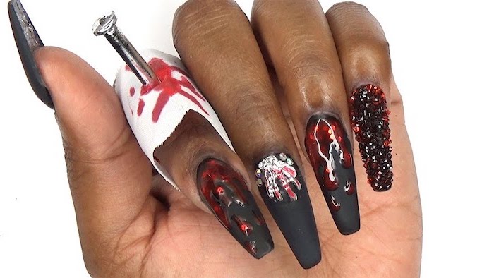 black matte nail polish, red nail polish, dripping down, red rhinestones, nail ideas, white background