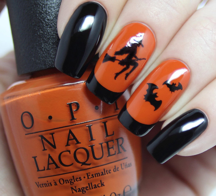 orange and black, nail polish, nail ideas, black witch and bats decorations, holding orange nail polish bottle