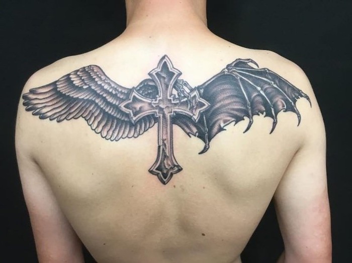 one angel wing, one devil wing, cross in the middle, back tattoo, small angel wings tattoo, black background