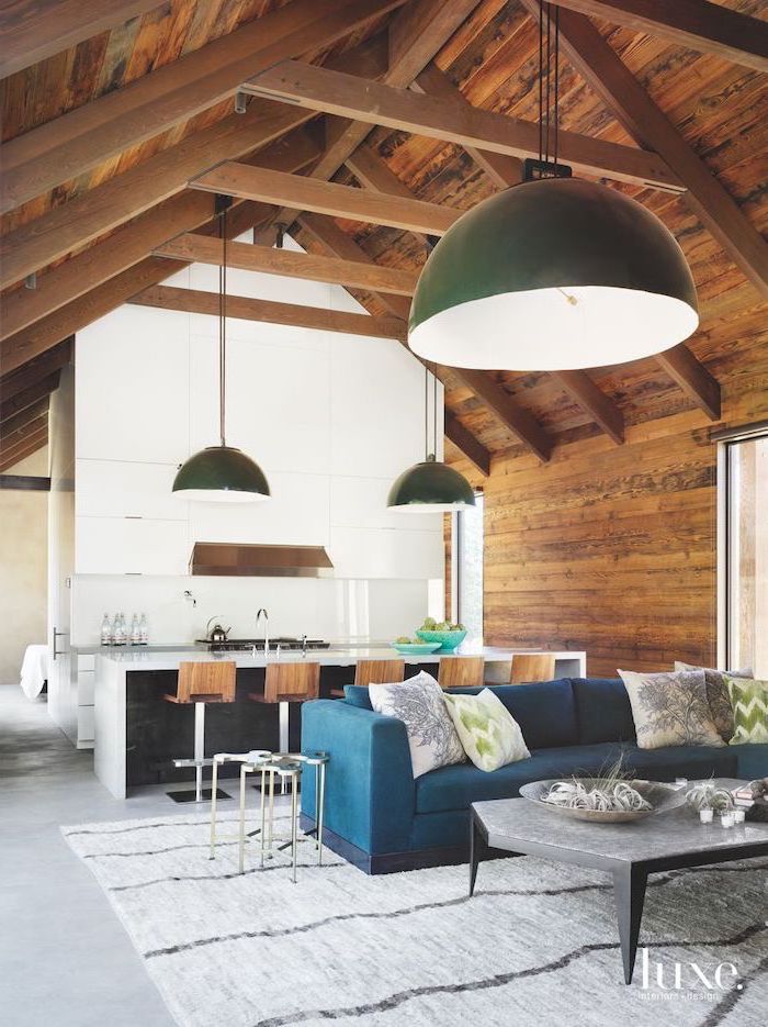 blue velvet sofa, green and grey, throw pillows, vault definition, wooden ceiling, kitchen island, wooden stools