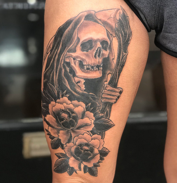 grey shorts, death reaper, skull with flowers, thigh tattoos, blurred background