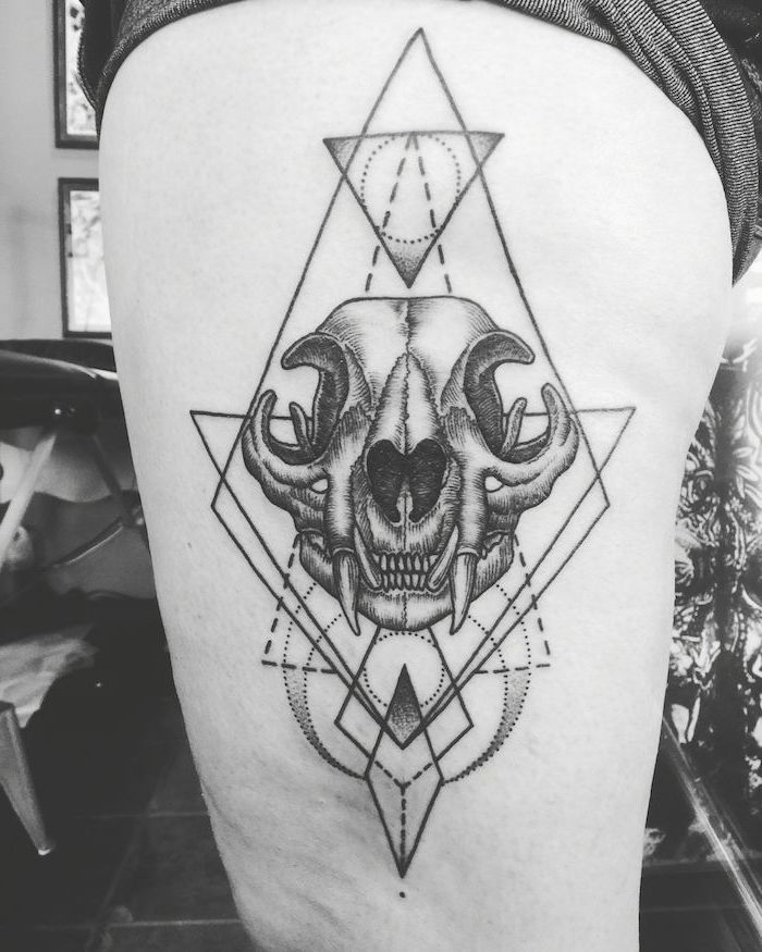 geometrical design, animal skull, thigh tattoos for girls, black and white photo