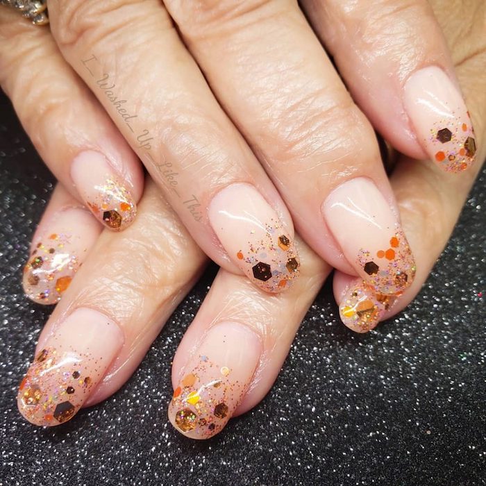nude nail polish, cute fall nails, gold and orange glitter, long squoval nails, black glitter table