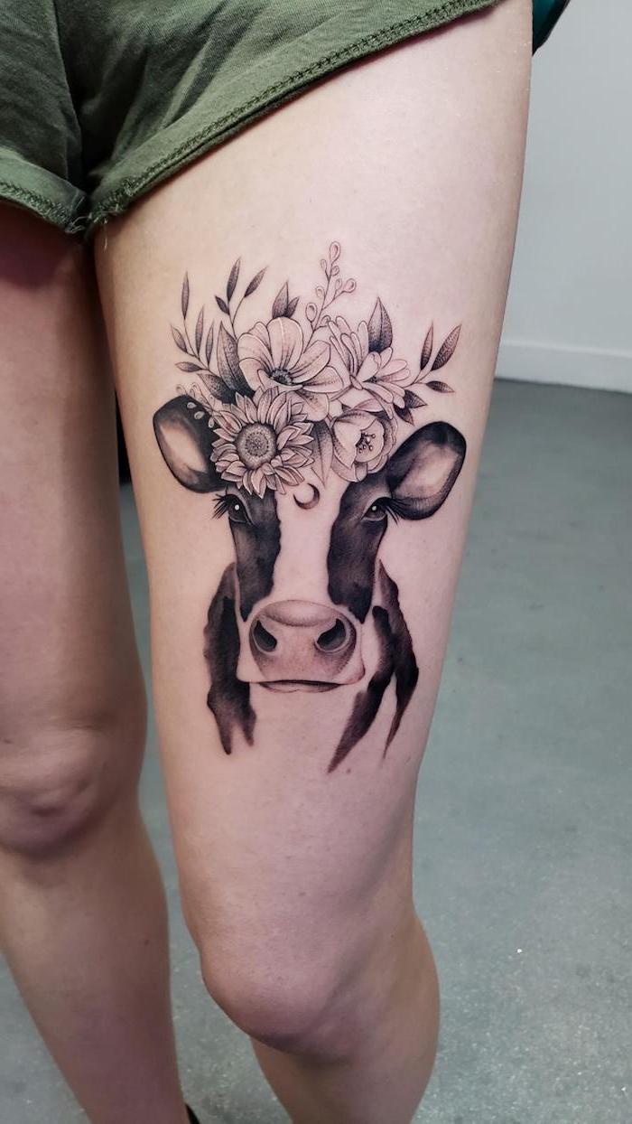 green shorts, cow with floral crown, rose thigh tattoo, white background