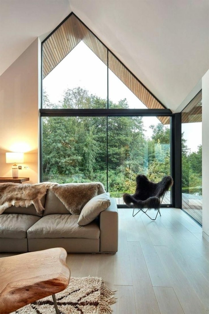 black armchair, grey sofa, wooden table, how to vault a ceiling, wooden floor, tall windows