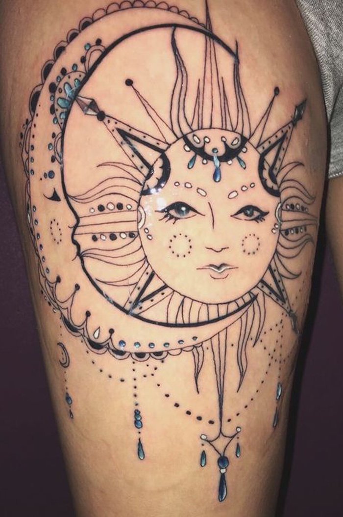 moon and sun, blue beads, mandala tattoo, lion thigh tattoo, grey shorts