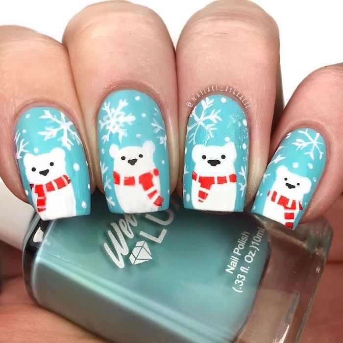blue nail polish on short square nails, different color nails, polar bear decorations on each nail