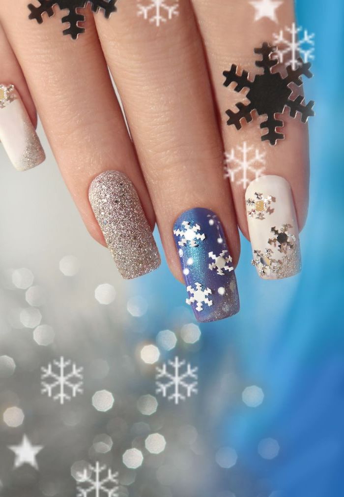 blue and white nail polish, silver glitter nail polish, nail colors, snowflakes decorations on the nails