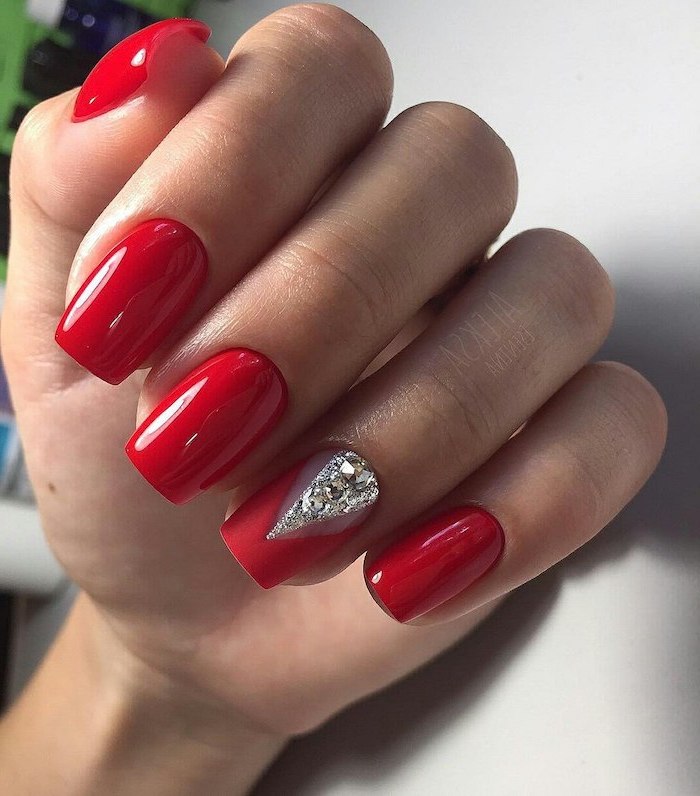 long nails with red nail polish, nail colors, silver rhinestones on the ring finger, medium length square nails