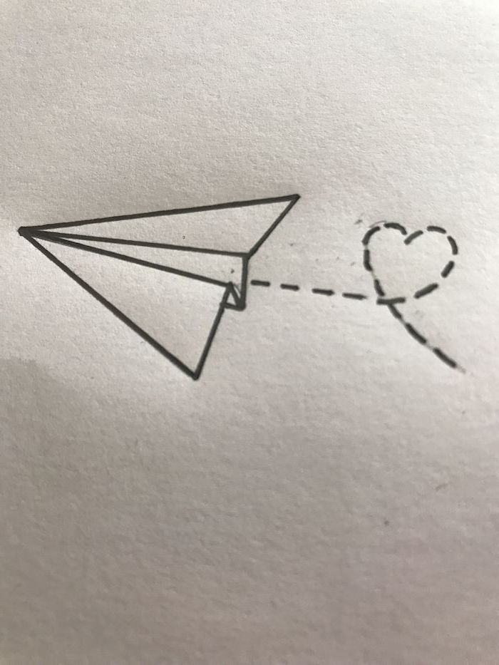 cute things to draw, flying paper plane, leaving a heart shaped trace behind it, black and white pencil sketch