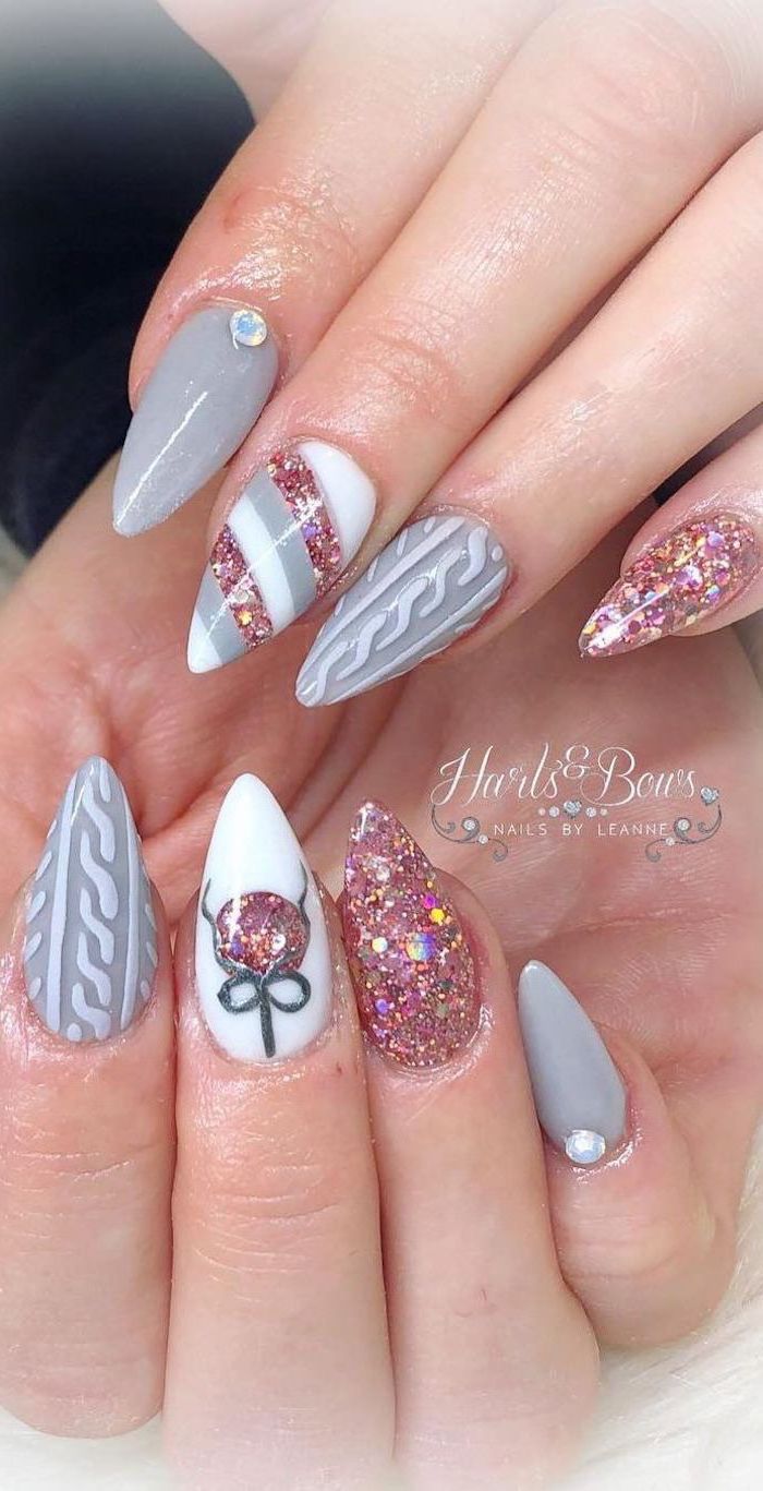 white and grey nail polish, winter nail designs, pink glitter nail polish, different decoration on each nail
