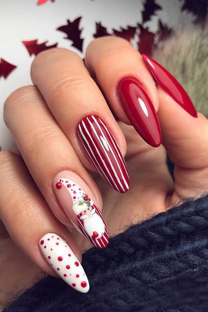 red and white nail polish on long nails, nude nail designs, santa decoration on ring finger