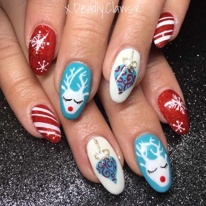 almond shaped nails, red white and blue nail polish, trending nail colors, different christmas themed decorations on each finger