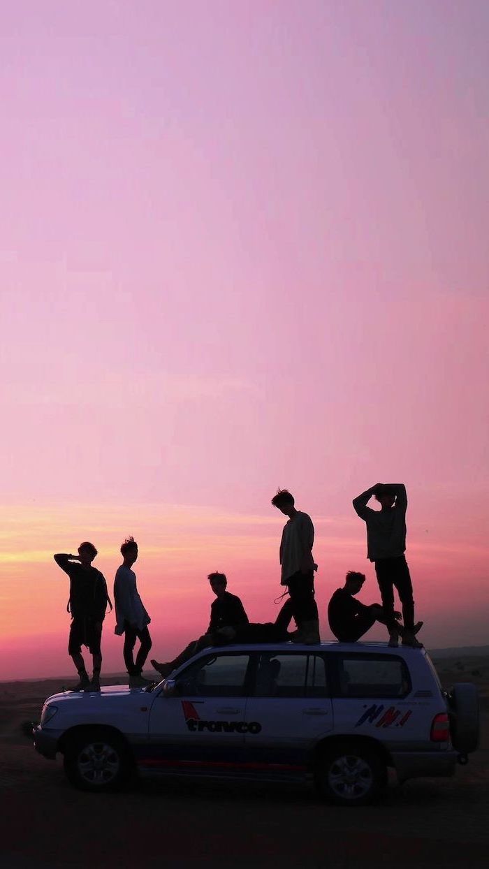 group of friends, standing or sitting on top of a jeep, parked on a road, cute aesthetic backgrounds, sunset purple sky