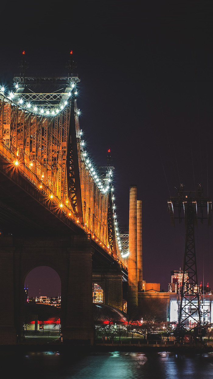 queensboro bridge in new york city, photographed at night, tumblr aesthetic backgrounds, city skyline in the background